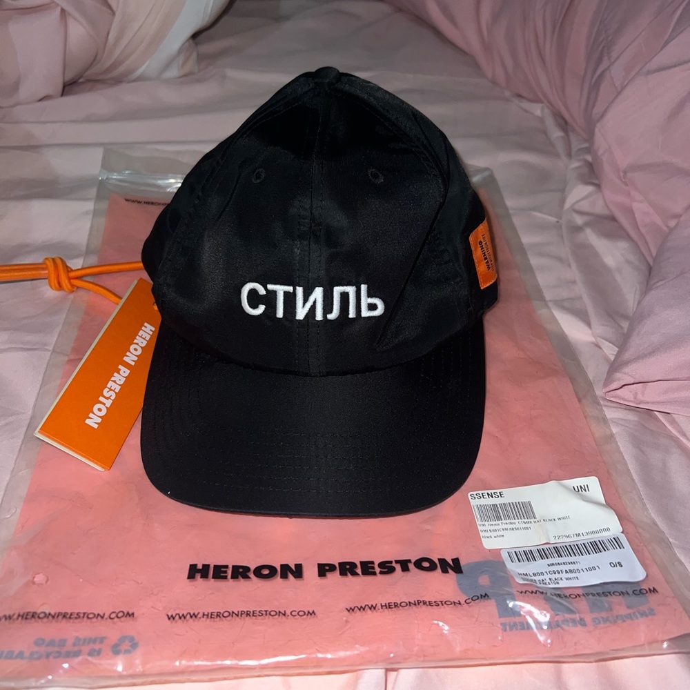 Heron Preston Black Cap with White Cyrillic Logo and Orange Tag